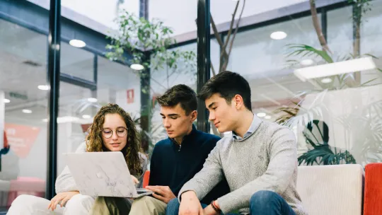 EAE Business School students working on a computer