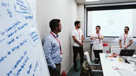 Team talking during class at EAE Business School