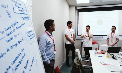 Team talking during class at EAE Business School