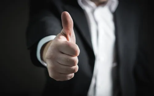 Person making an optimistic gesture