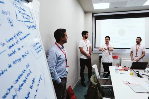 Team talking during class at EAE Business School